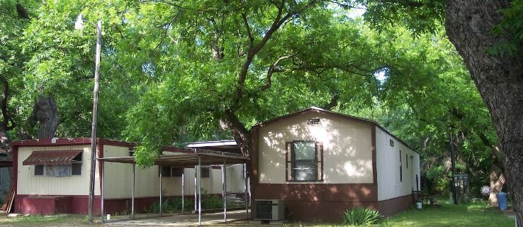 Mobile homes under mature pecan trees